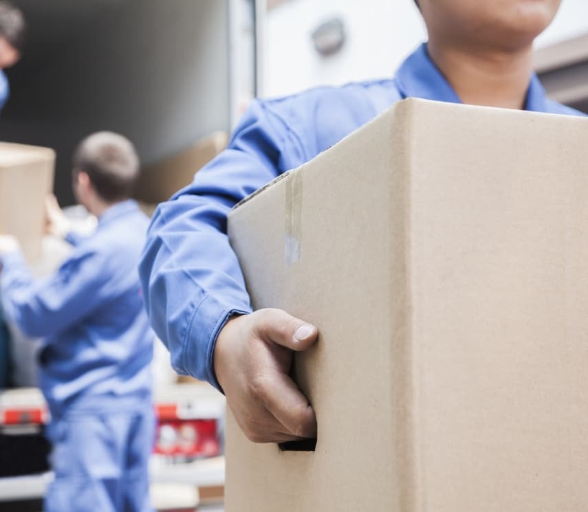 Crew loading and unloading the moving truck