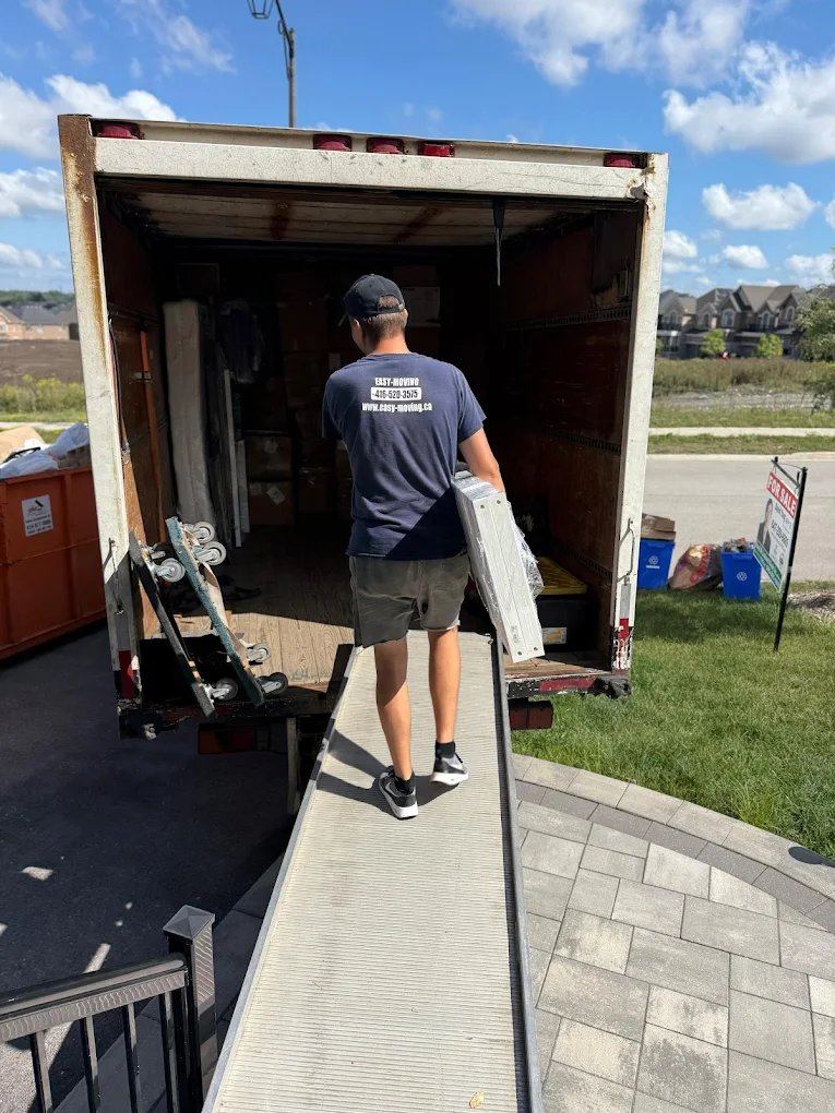 Wrapping furniture on move day before truck-load